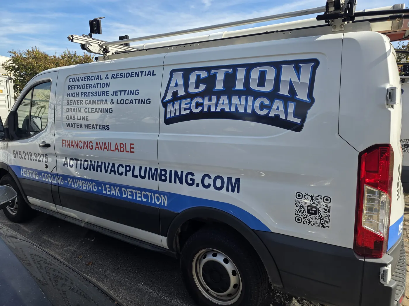 Side of an Action Mechanical van with the company logo and service list